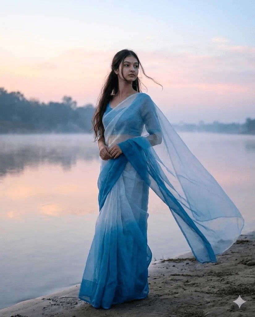 Riverside saree prompt preview with soft blue saree and misty dawn light