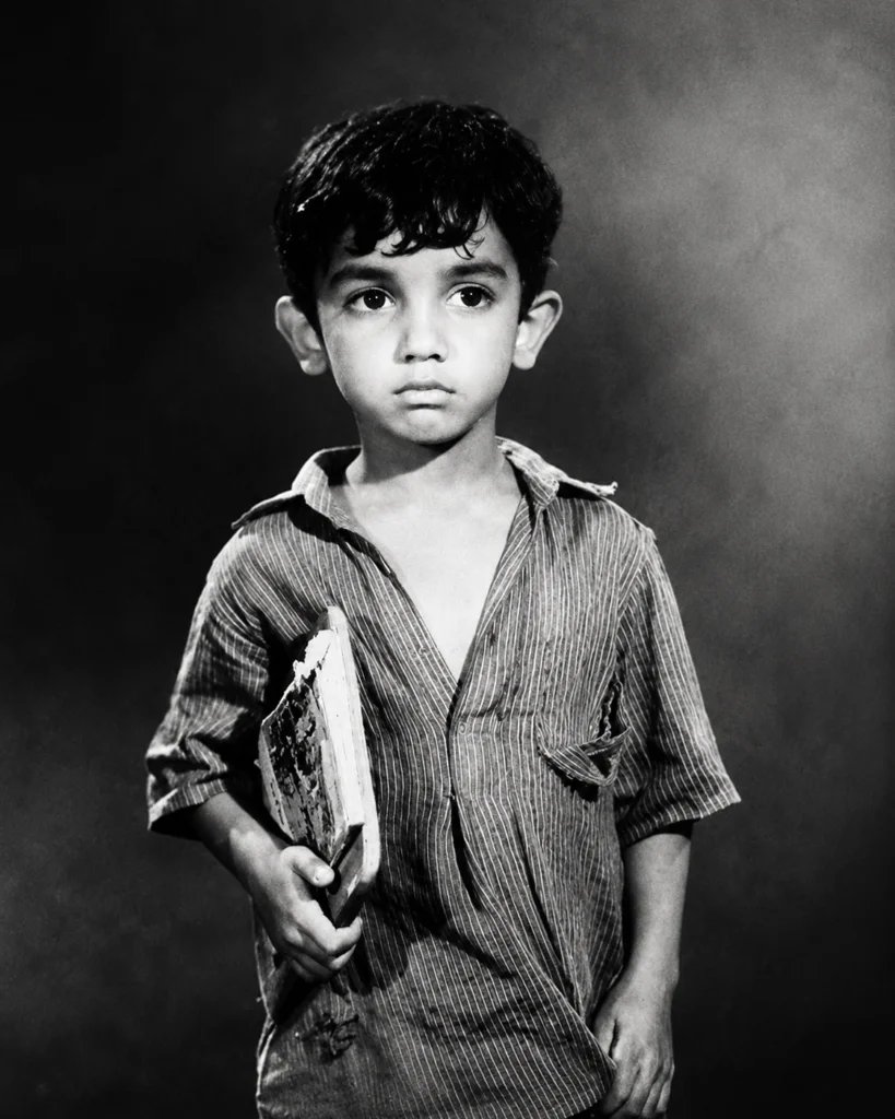 Fine-art black and white childhood portrait with soft directional light
