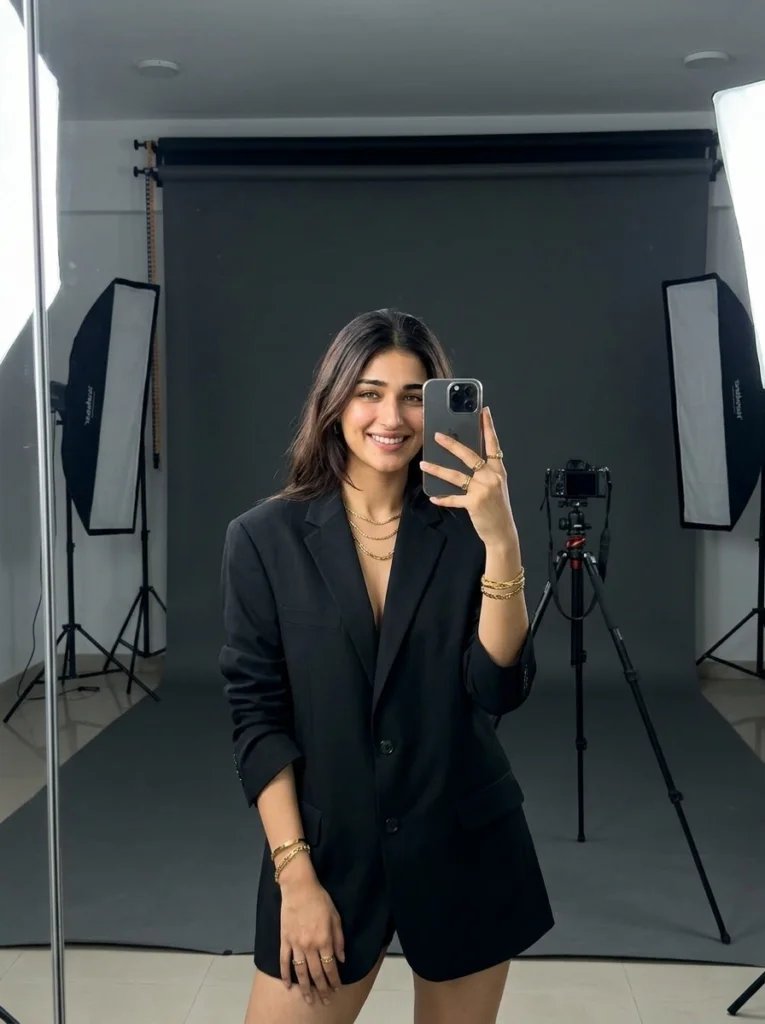 Gemini AI mirror selfie prompt preview with professional studio backdrop, floor mirror, softbox light, and oversized blazer