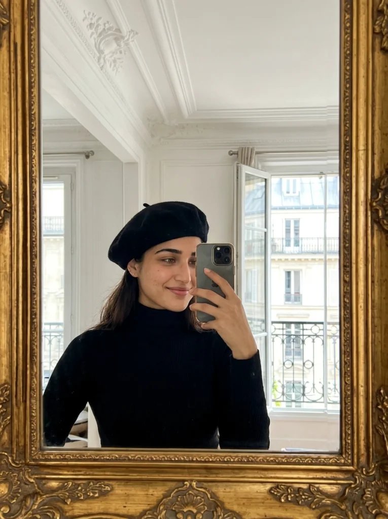 Gemini AI mirror selfie prompt preview with Paris apartment, gold-framed mirror, balcony light, black turtleneck, and beret