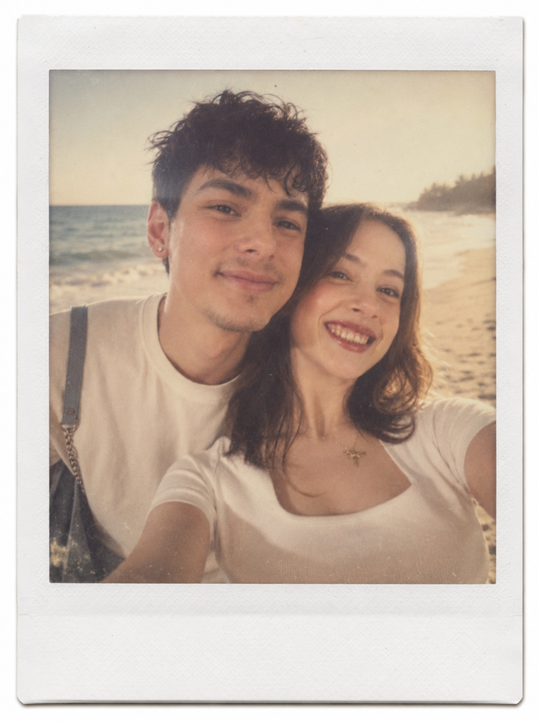 Couple at the beach in a faded vintage Polaroid photograph with a white frame