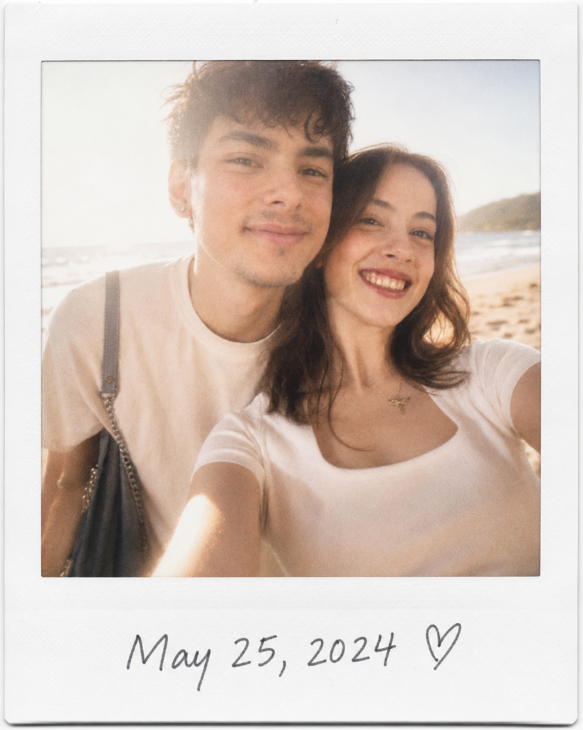Couple laughing at the beach in a warm vintage Polaroid-style photograph