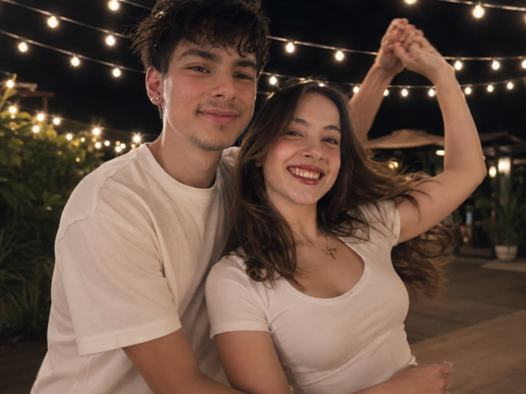 Couple dancing joyfully under warm string lights at night