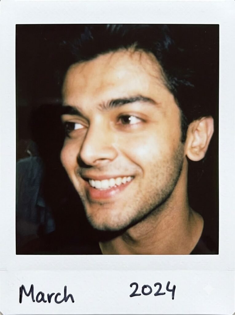 Close-up Polaroid-style portrait with direct flash and soft film grain
