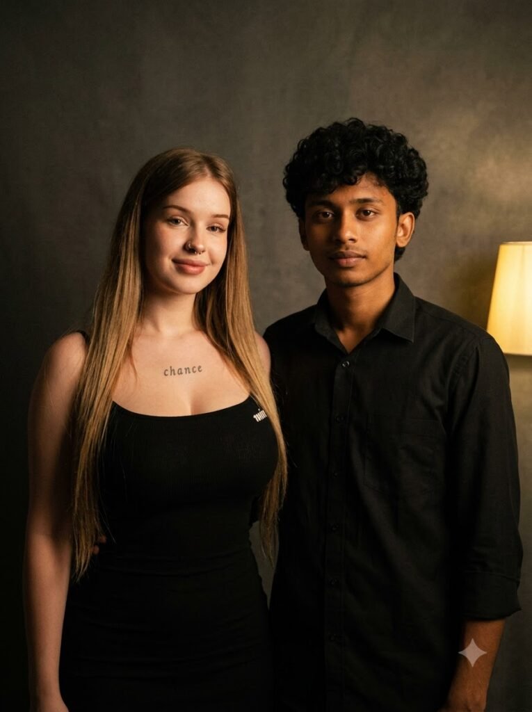 Couple standing together with one warm lamp lighting both faces