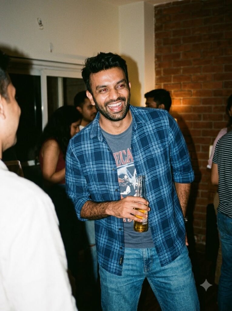 1990s candid portrait of a laughing man with a grainy flash-photo look