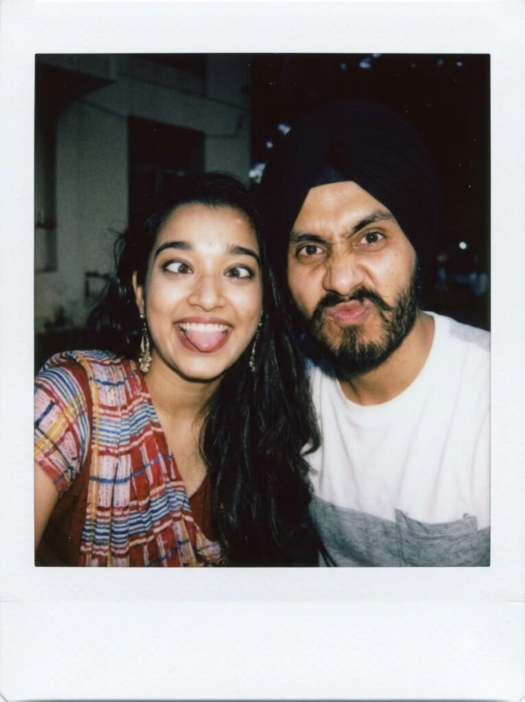 Two friends making funny faces at the camera in a Polaroid-style photo