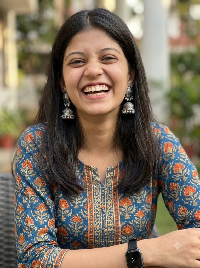 Woman laughing in a printed fusion kurti with statement earrings