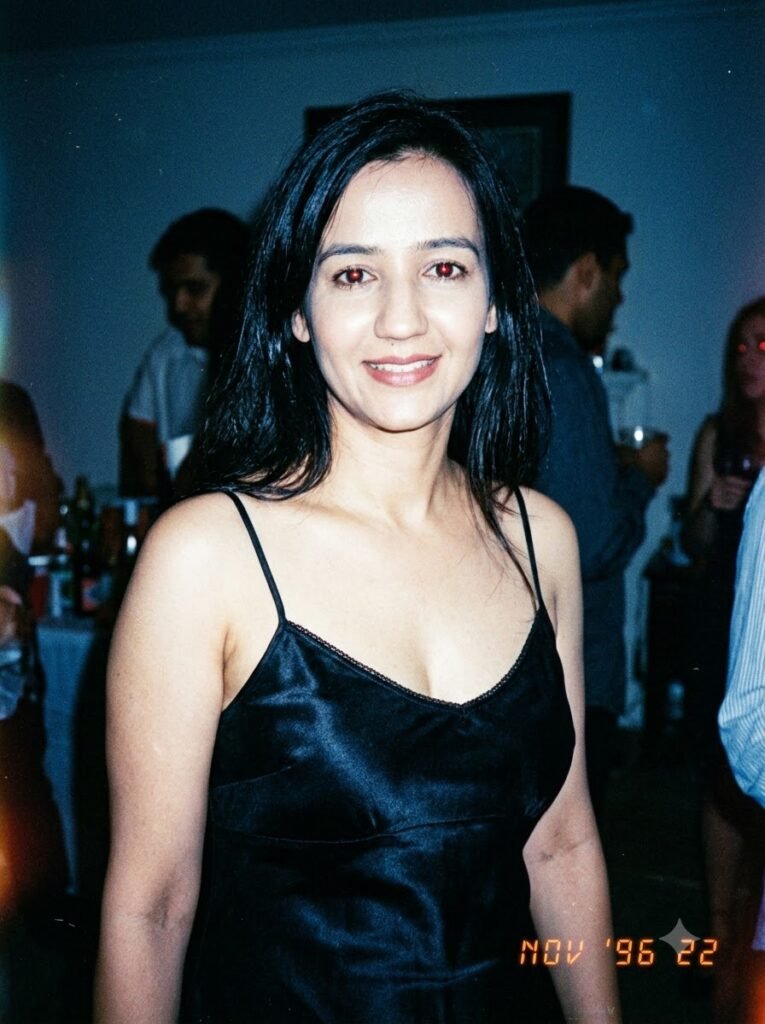 1990s candid portrait of a woman in a slip dress with direct flash lighting